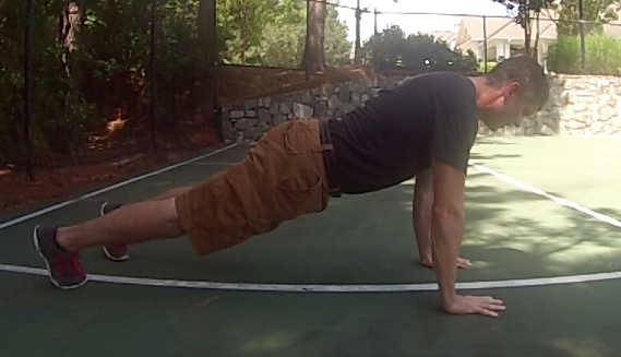 Brandon demonstrating proper body alignment in the upright push-up position. 