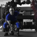 Brandon Richey Fitness student Jeremy about to perform a kettlebell clean to check off a movement in one my online coaching fitness programs