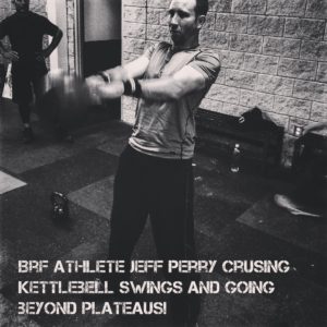 Black and white image of retired US National Muay Thai champion Jeff Perry performing kettlebell swings with Brandon's workout. 