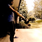 Image of a female athlete performing single arm kettlebell swings. 